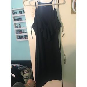 Black fitted dress with ruffles down front